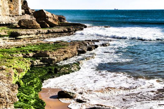 Beautiful Azarujinha beach with rock formations in Estoril, Lisbon, Portugal, in a sunny day of winter