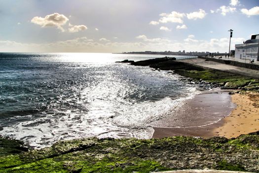 Beautiful Azarujinha beach with rock formations in Estoril, Lisbon, Portugal, in a sunny day of winter