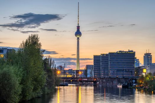 The famous Television Tower and the river Spree in Berlin at dusk