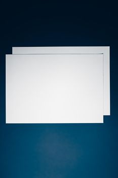 Blank A4 paper, white on blue background as office stationery flatlay, luxury branding flat lay and brand identity design for mockup.