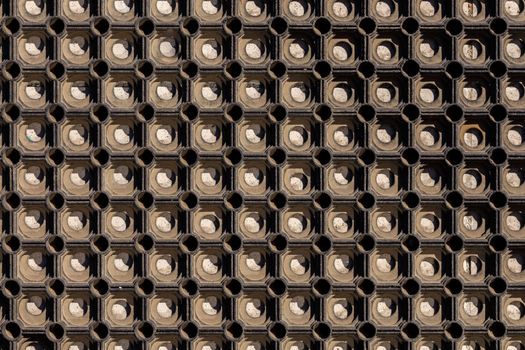 texture and background of used dusty cellular rubber floor mat - view directly above
