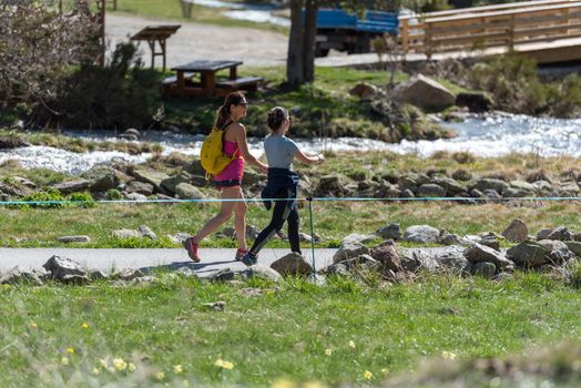 Vall de Incles, Andorra : 2021 May 07 : Two women trekking in the vall de incles in Andorra in spring 2021.