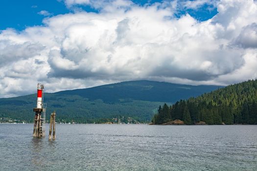 Beautiful view over ocean harbor with ship channel light in Vancouver, Canada. - Image