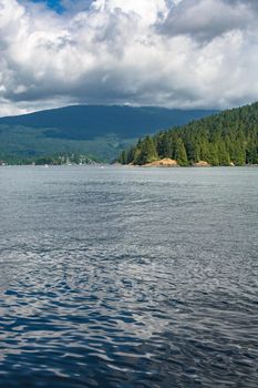 Beautiful view over ocean harbor and mountain on cloudy day in Vancouver, Canada. - Image