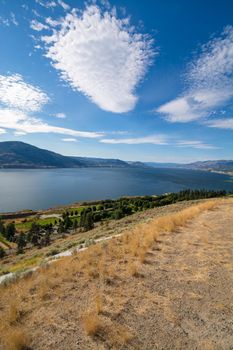 Magnificent view over Okanagan lake and valley with bizarre clouds in the sky