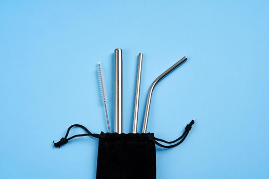 Environmental trend reusable metal beverage straws kit with cleaning tool in transportation bag.