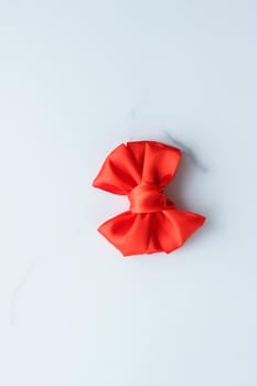 Holiday decor, feminine design and flatlay concept - Red silk ribbon on marble, top view