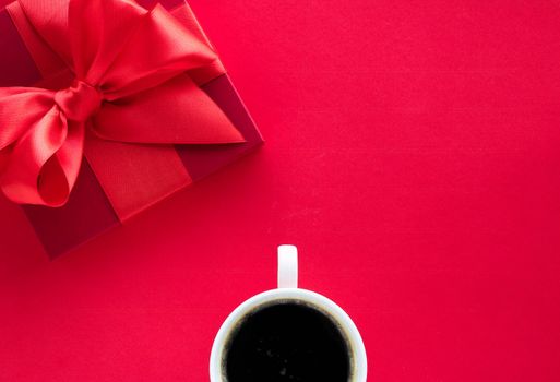 Romantic celebration, lifestyle and birthday present concept - Luxury beauty gift box and coffee on red, flatlay