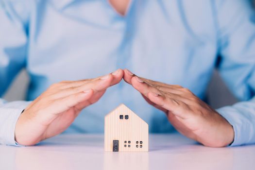 Insurance house for security and care, real estate, costs and loan and mortgage, protection of home and advisor with investment in residential, assurance of property for finance, business concept.