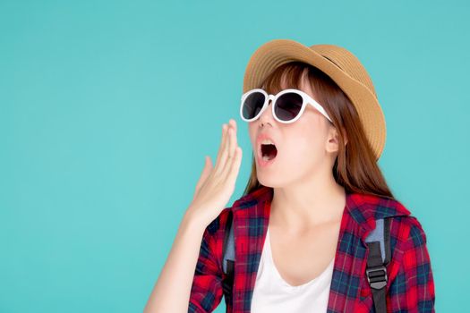 Beautiful young asian woman shouting sound loud with mouth for announce something in vacation travel with excited isolated on blue background, tourist asia girl journey in summer concept.
