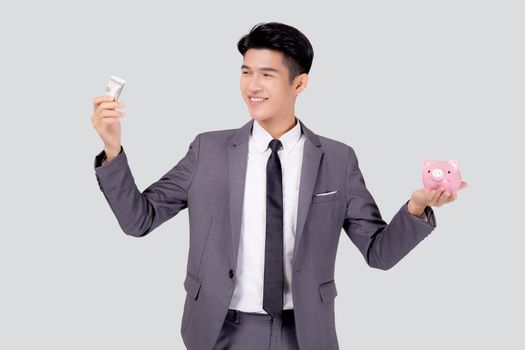 Young asian businessman in suit deposit money dollar with piggy bank isolated on white background, business man saving with planning budget and finance for success investment and financial.
