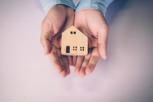 Insurance house for security and care, real estate, costs and loan and mortgage, protection of home and advisor with investment in residential, assurance of property for finance, business concept.