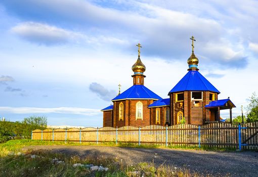 Murmansk, Russia. wooden chapel with a blue roof on the shore of the Kola Bay.