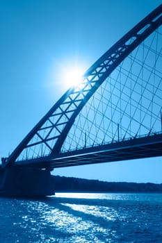 Natural landscape with a river and a bridge in the light of the contour. Novosibirsk, Russia