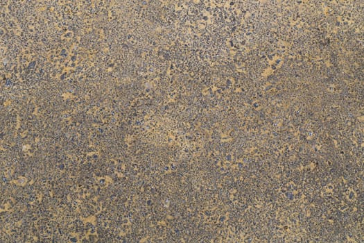 yellow sand covered asphalt texture and background, directly above view