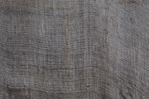 old dry grey rag drying outdoors - close-up background and texture.