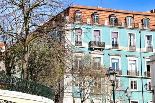 Narrow and colorful streets, majestic facades, windows and balconies of Lisbon, Portugal