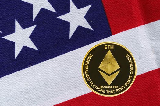 Crypto currency concept. Gold Ethereum coin on flag of United States of America USA