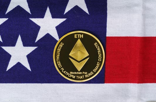 Crypto currency concept. Gold Ethereum coin on flag of United States of America USA