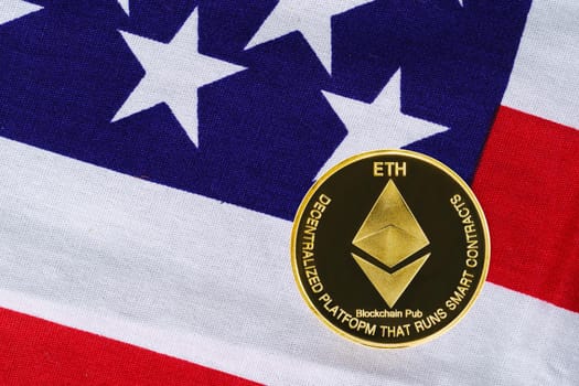 Crypto currency concept. Gold Ethereum coin on flag of United States of America USA