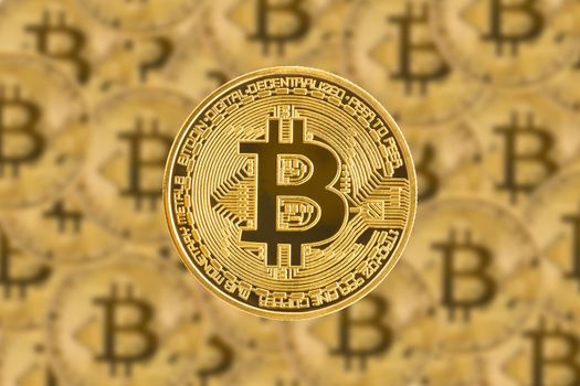 Close up golden bitcoin symbol with coin background