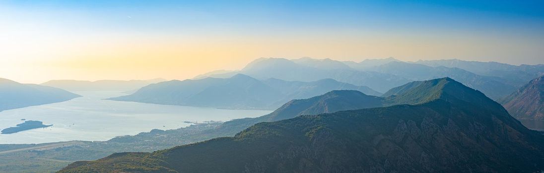 Kotor bay mountains in Montenegro. Sunset scenery with sea and sky.