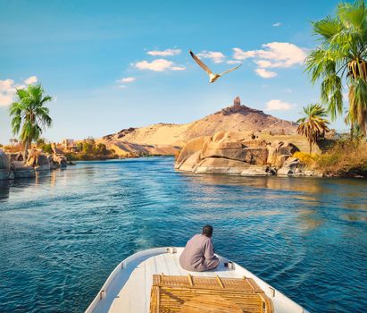 Boat driving on river Nile in Aswan, Egypt