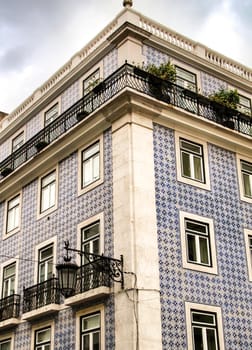 Narrow and colorful streets, majestic facades, windows and balconies of Lisbon, Portugal