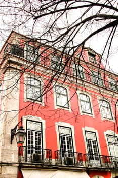 Narrow and colorful streets, majestic facades, windows and balconies of Lisbon, Portugal