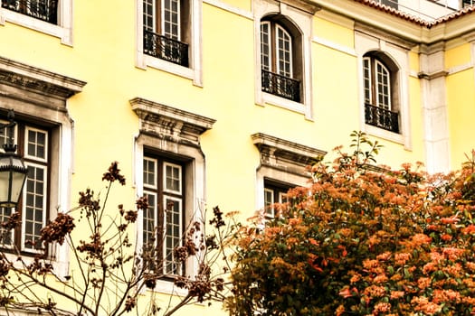 Narrow and colorful streets, majestic facades, windows and balconies of Lisbon, Portugal