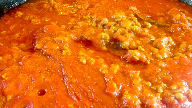 Saucepan with tomato and meat sauce called Bolognese