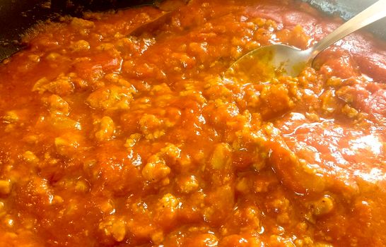 Saucepan with tomato and meat sauce called Bolognese
