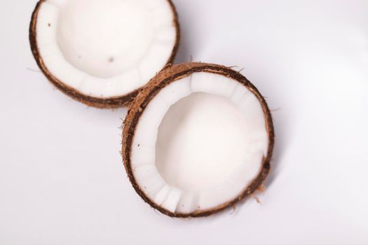 opened coconut isolated on white background. tropical fruit, nut.