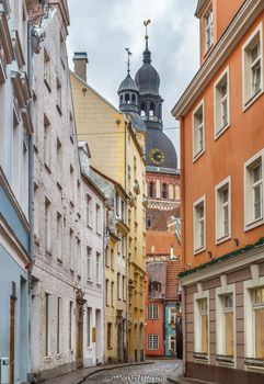 Street in Riga old town with Dome cathedral, Latvia