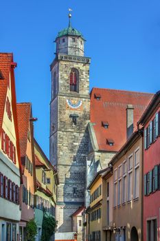 Street in Dinkelsbuhl with historical houses and St. George Minster, Bavaria, Germany