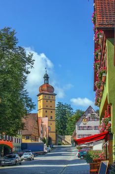 Street in Dinkelsbuhl with historical houses and Segringen gate, Bavaria, Germany