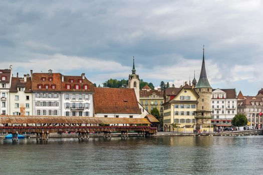 Picturesque historical buildings on the embankment of Reuss river in Lucerne, Switzerland