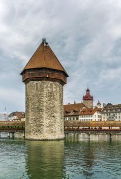 As part of the bridge complex, the Kapellbrucke includes the octagonal tall Wasserturm (water tower), Lucerne,Switzerland