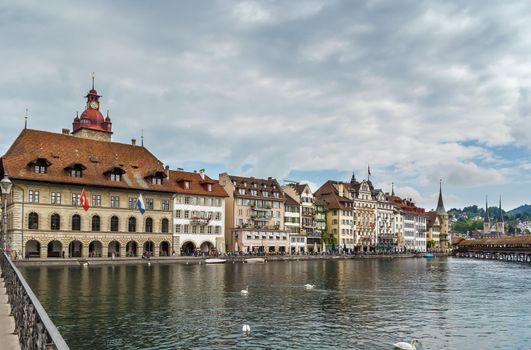 Picturesque historical buildings on the embankment of Reuss river in Lucerne, Switzerland