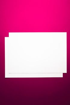 Blank A4 paper, white on pink background as office stationery flatlay, luxury branding flat lay and brand identity design for mockup.