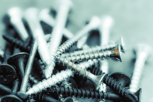 Different Kind of Screws on a table in a workshop