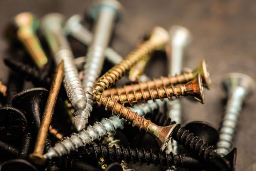 Different Kind of Screws on a table in a workshop