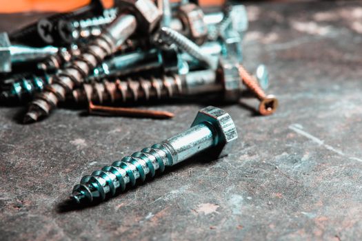 Different Kind of Screws on a table in a workshop