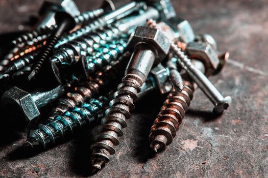 Different Kind of Screws on a table in a workshop