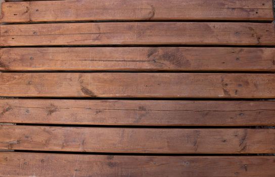 Brown wooden boardwalk.Beautiful rustic background.