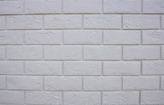 Abstract texture , white brick wall background, rough masonry blocks, architectural wallpaper.