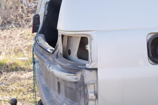 close up of old rusty broken automobile. car crash or fire consequence