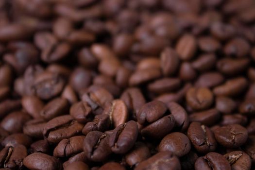 close up Freshly roasted coffee beans background. top view.