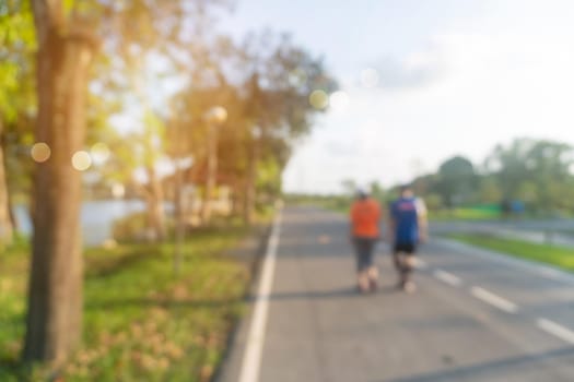 Blur public exercise park for people runnung, jogging and walking. Healthy living lifestyle background.