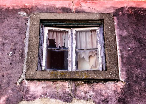 Old and colorful damaged facade in Lisbon